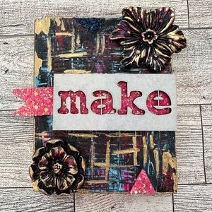 Mixed media wooden block.